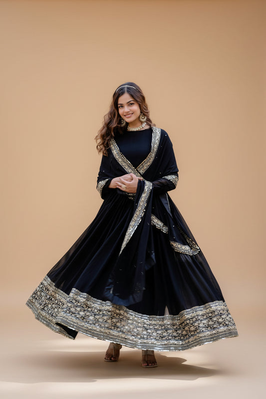 This Elegant Black Gown Features